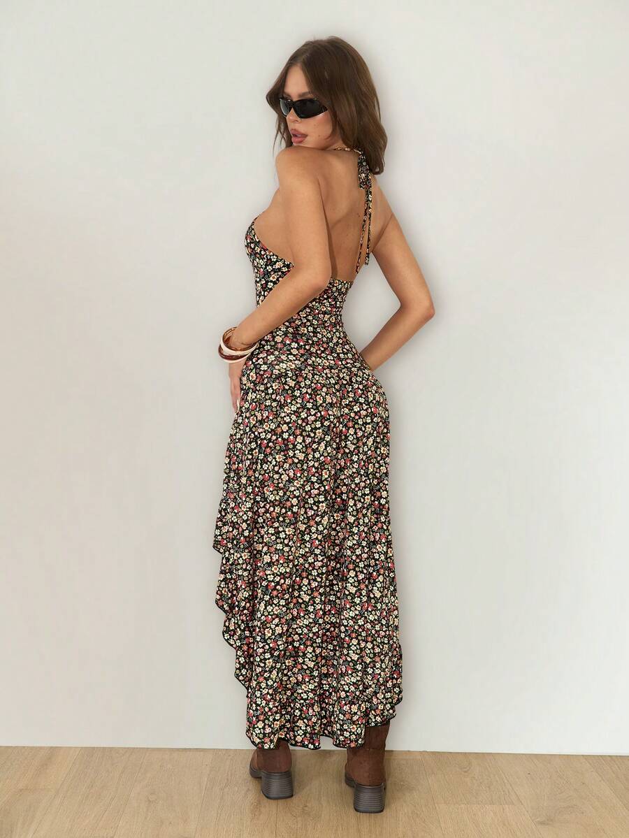 Rear three-quarter view of open-back floral high-low dress with ankle-length draped hem