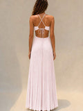 Mint green pleated halter maxi dress at beach resort, front view