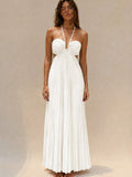 White pleated open-back maxi dress with crossed straps, rear view