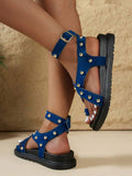 Side and rear view of blue buckle-strap sandals with open heels