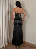 Back view of black lace-up corset and satin mermaid maxi skirt