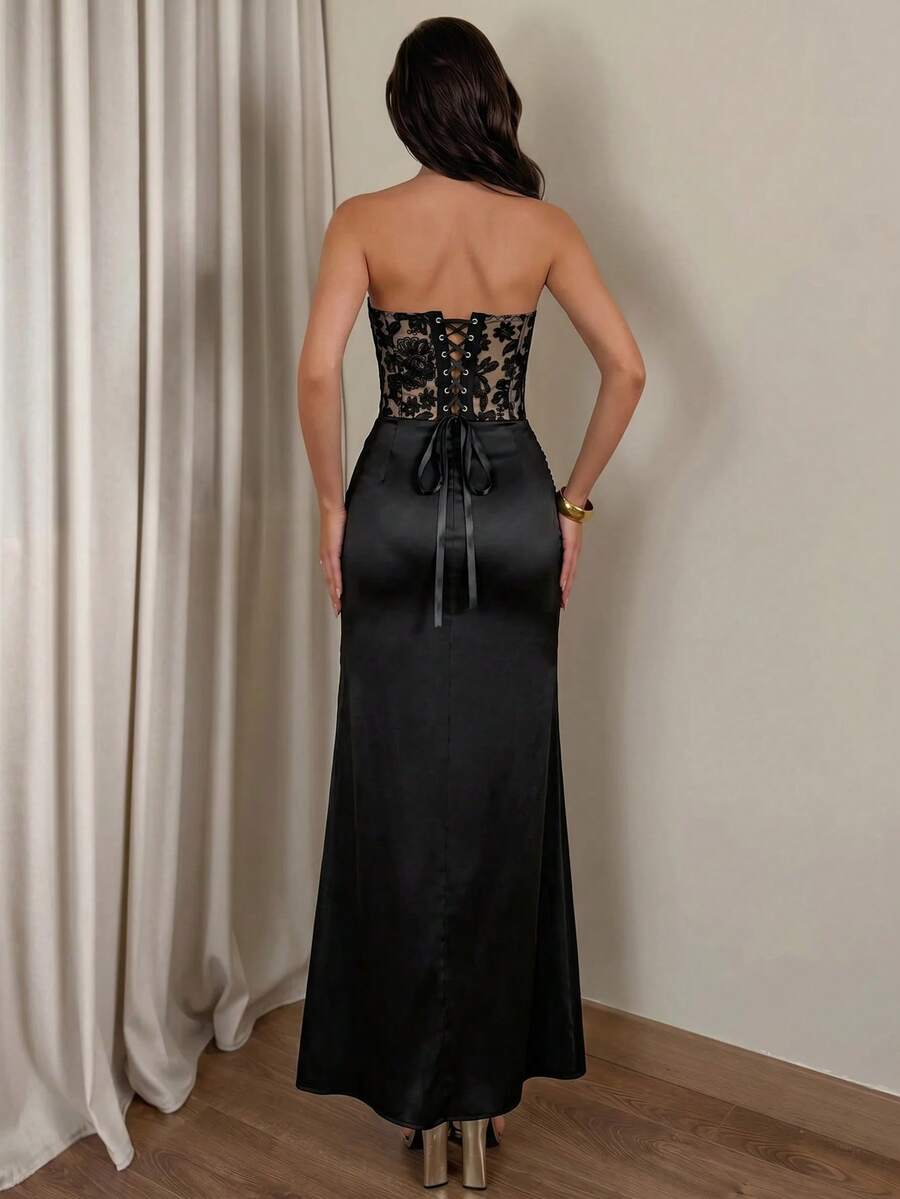 Back view of black lace-up corset and satin mermaid maxi skirt