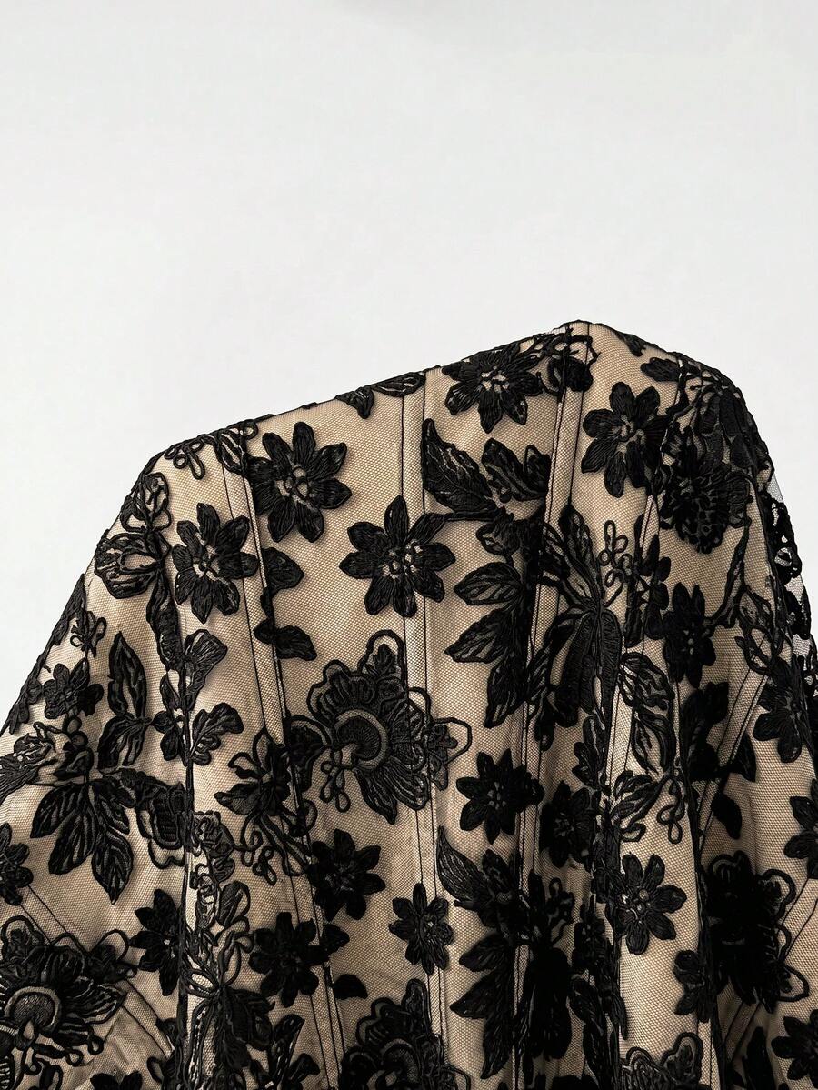 Close-up front view of black eyelash lace corset bodice with boning