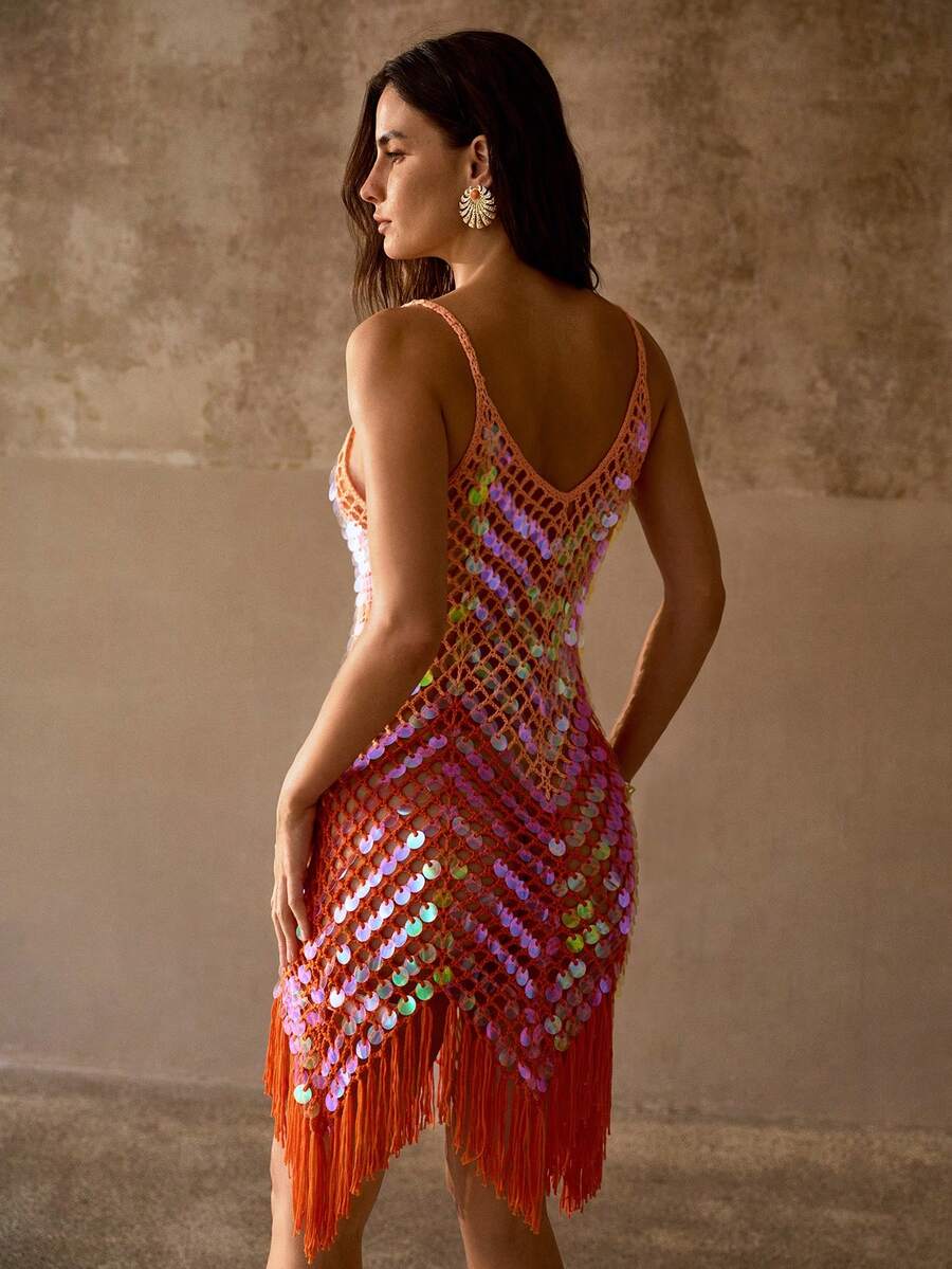Back view of coral orange sequin beach cover-up with deep V back and sheer diamond mesh