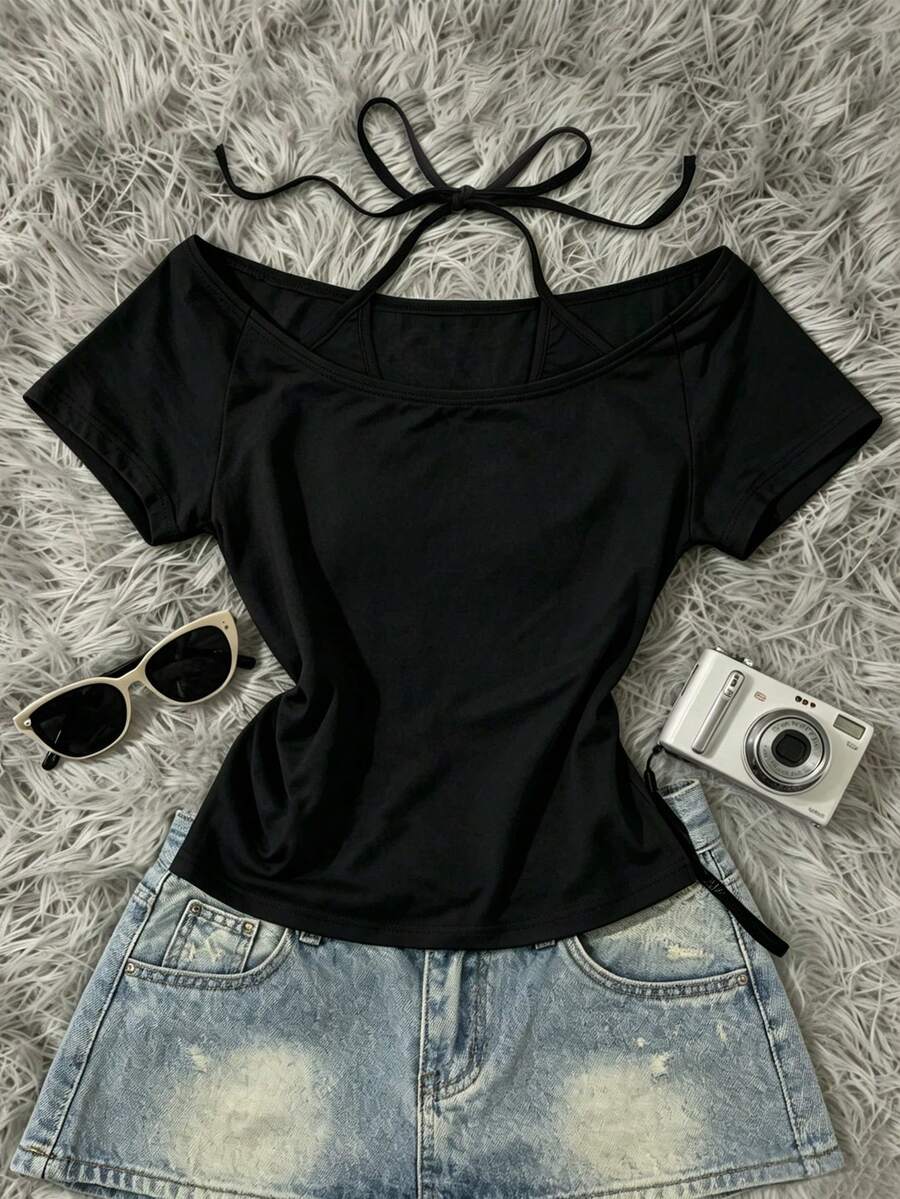 Front flat lay of black solid off-shoulder halter top with tie neckline for casual wear