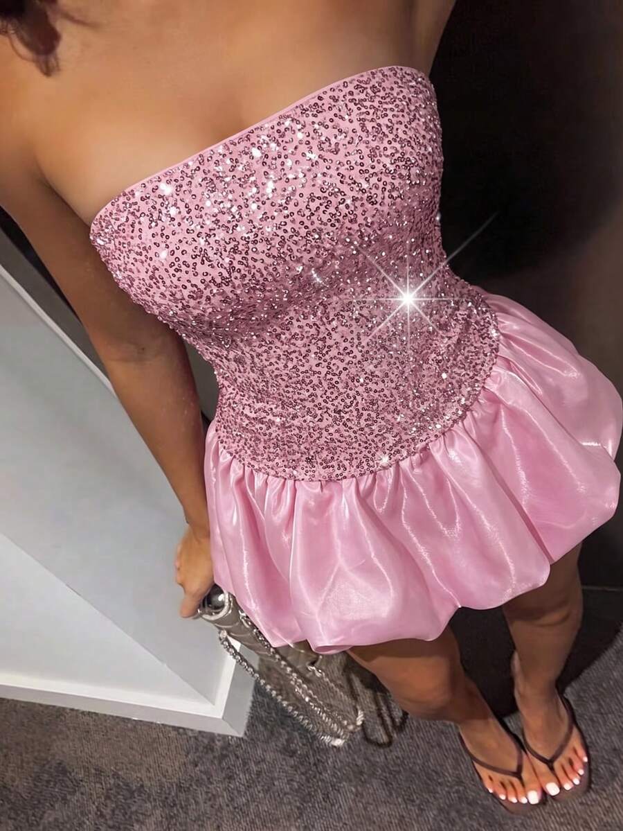 Full-length view of pink strapless sequin party gown