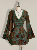 Front mannequin view of green botanical velvet mini dress with lace V-neck and flounce sleeves