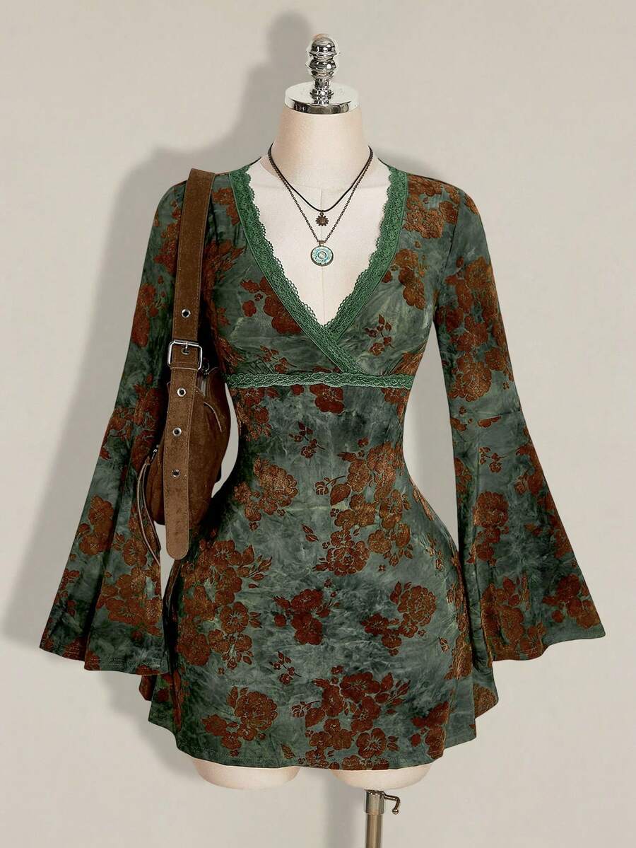Front mannequin view of green botanical velvet mini dress with lace V-neck and flounce sleeves
