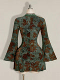 Rear mannequin view of green floral mini dress showing shallow scoop neck and shaped waist seams