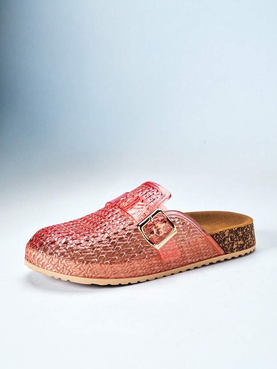 Side profile of translucent pink jelly clog with beige lug sole