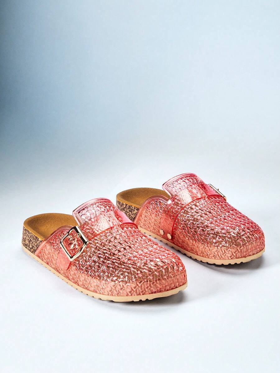 Product pair of translucent pink buckle clog mules