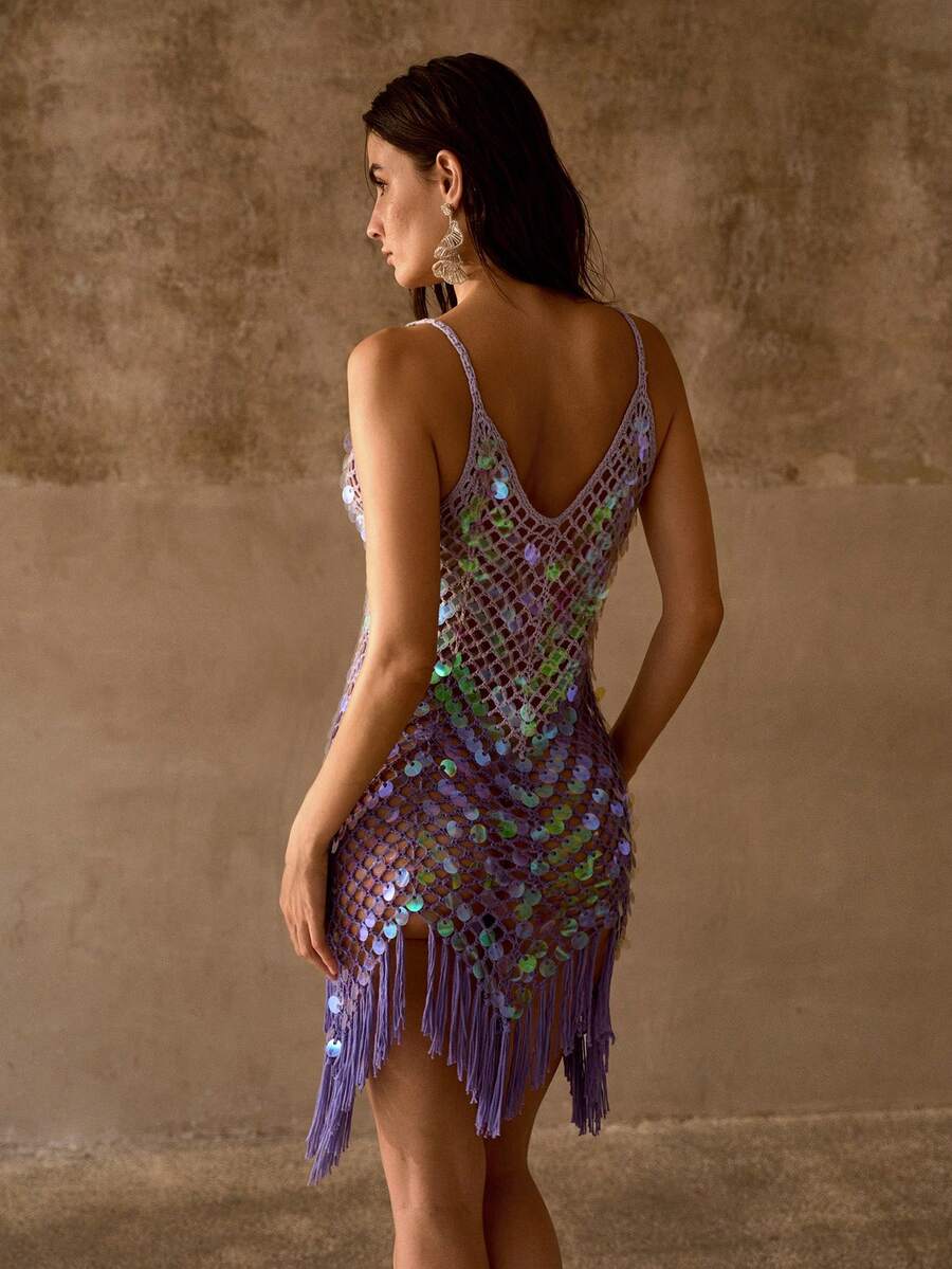 Back view of lavender sequin swim cover-up with deep V back, sheer mesh, and fringe hem