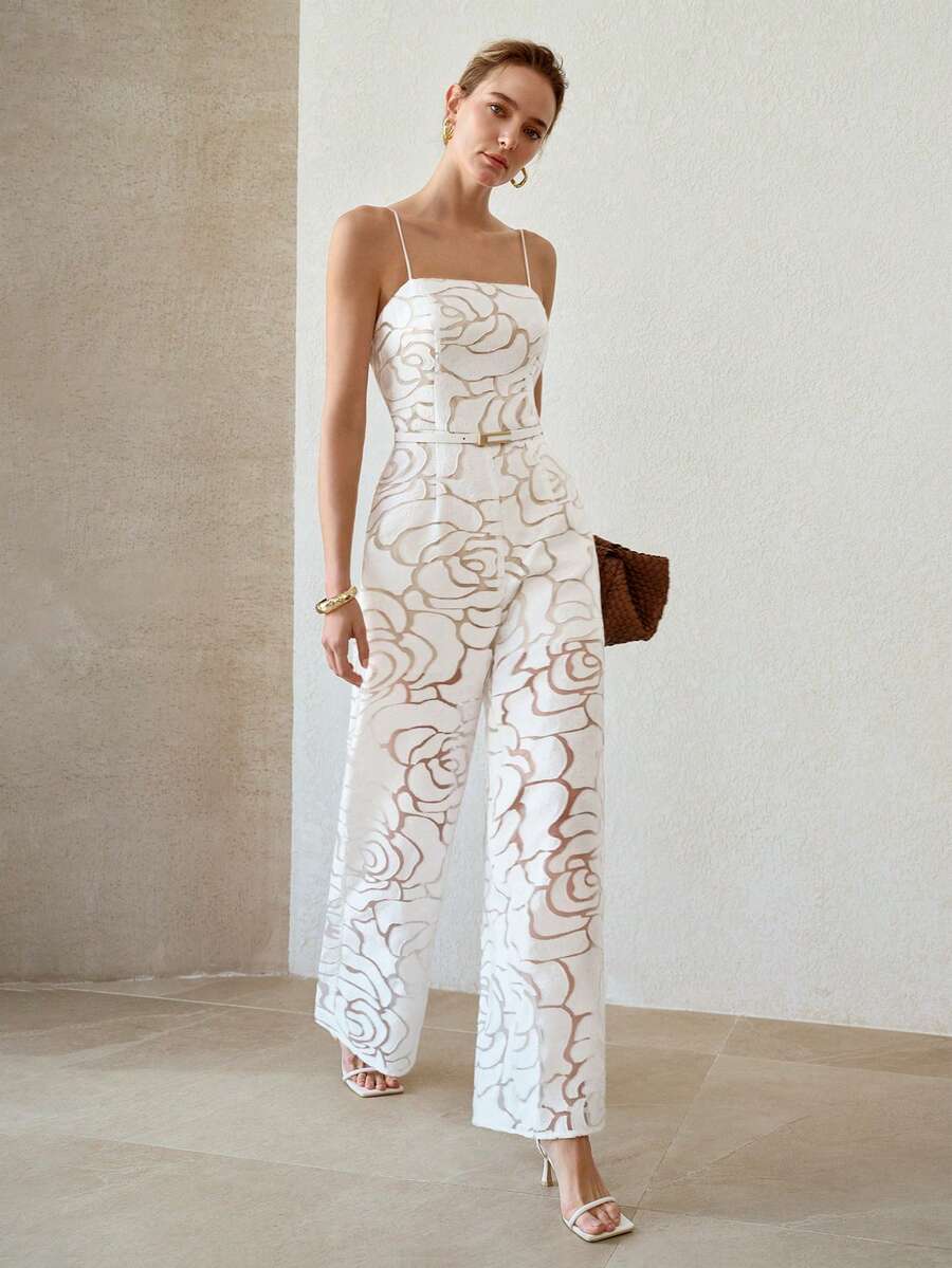 Full front view of white rose texture wide-leg jumpsuit styled with heels and woven clutch