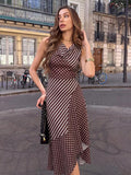 Three-quarter view of brown polka dot and stripe dress with draped cowl neckline and ruffle hem