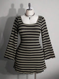 Front view of black and cream striped A-line mini dress with fitted waist