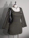 Front view of black striped knit mini dress with square neckline and long bell sleeves