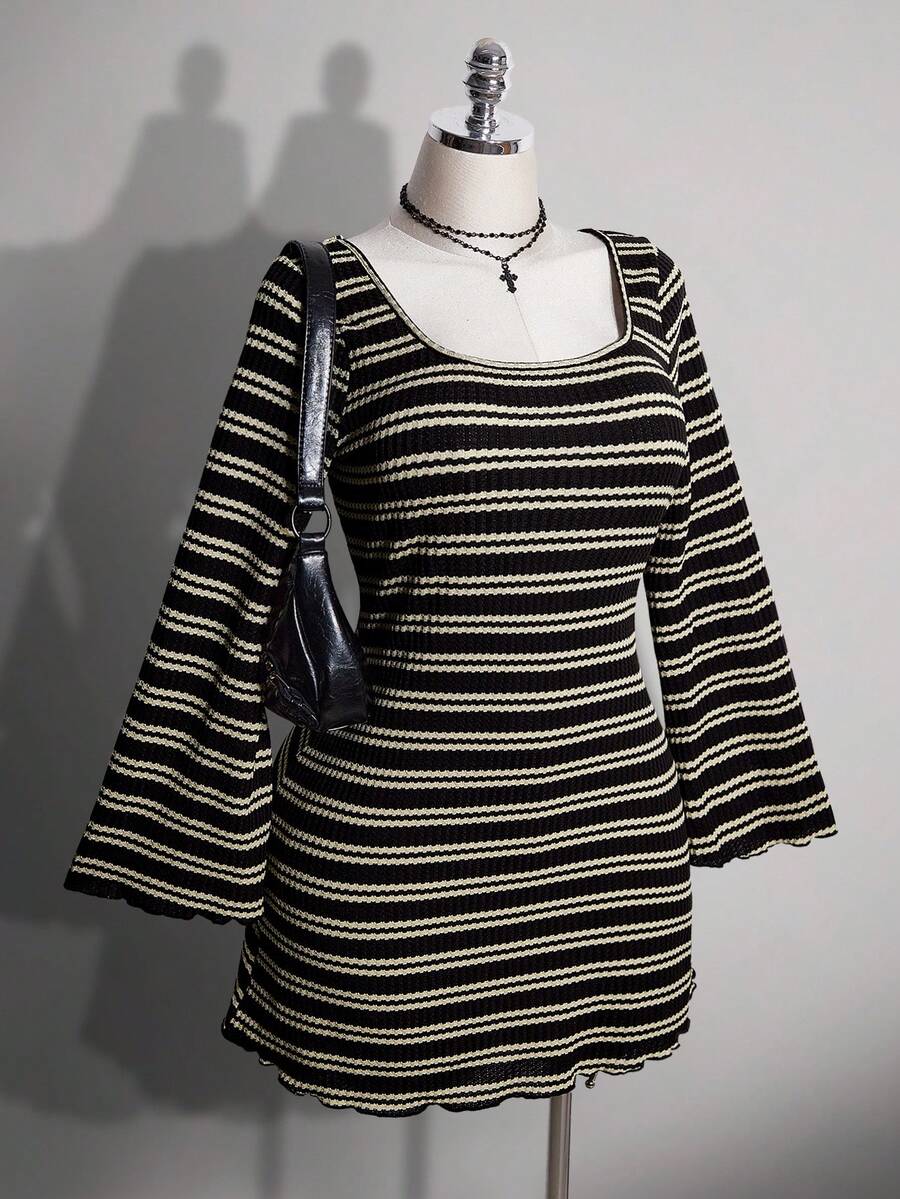Front view of black striped knit mini dress with square neckline and long bell sleeves