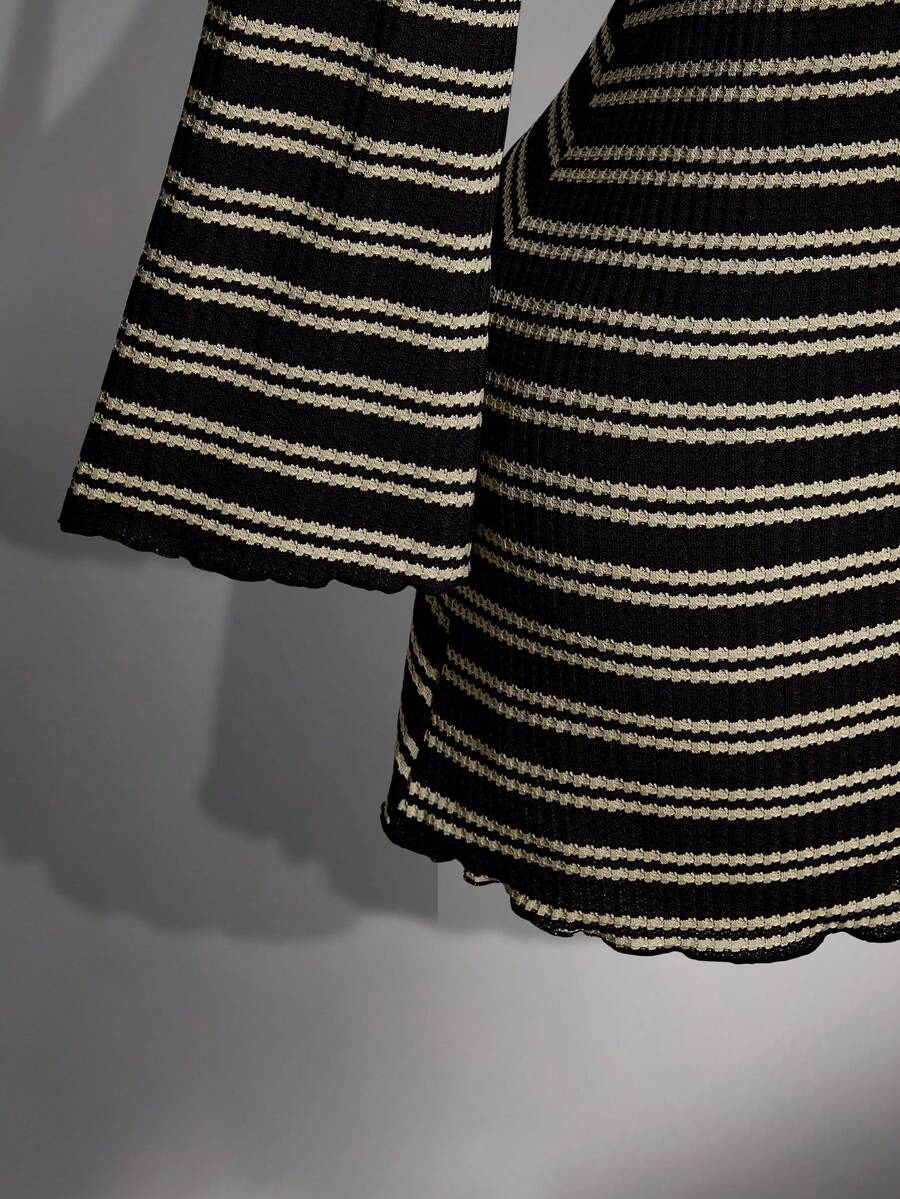 Close-up of flared bell sleeve and striped knit texture
