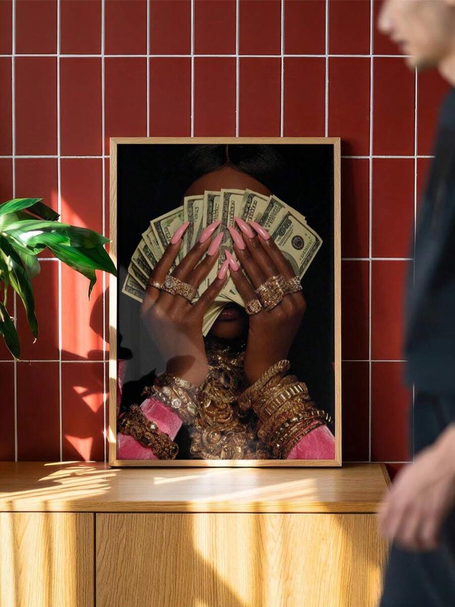 Color portrait of woman holding U.S. dollar bills with pink sleeves and gold jewelry