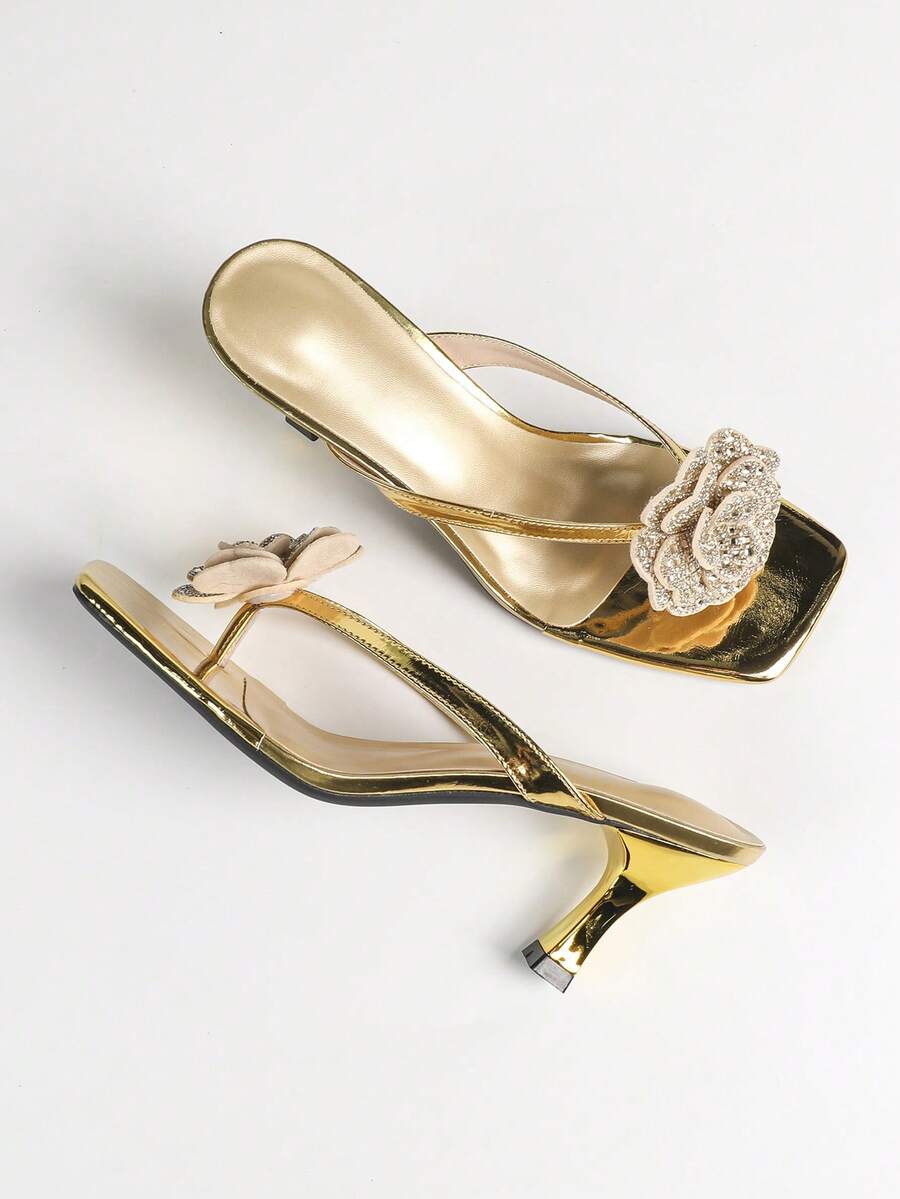 Overhead side view of metallic gold rhinestone rose square-toe mule sandals with flared kitten heel for event styling