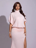 Draped open back of blush pink batwing evening maxi dress