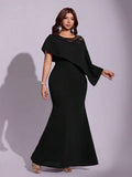 Shop a plus size black lace A-line dress with patchwork and a ruffle cape. Perfect for summer parties, weddings, dinners, cocktails, and special occasions.