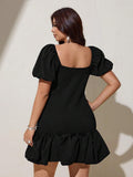 Black fitted mini dress with puff sleeves and gathered bubble hem