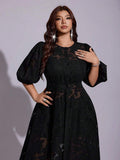 Side view of black sheer floral maxi dress with high front slit
