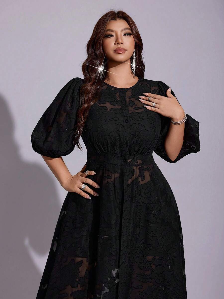 Side view of black sheer floral maxi dress with high front slit