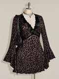 Angled front view showing lace-trimmed deep V neckline and high waist on leopard dress