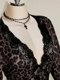 Close-up of black floral lace crossing the deep V neckline on leopard print dress