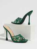 Green floral-lace square open-toe mule pair with flared stiletto heels