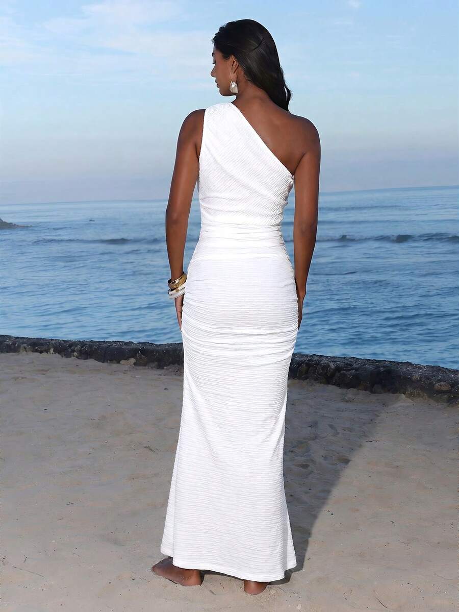 Back view of white one-shoulder ruched bodycon maxi dress for beach vacation styling