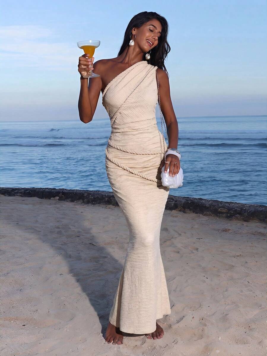 Full front view of cream beige one-shoulder ruched bodycon maxi dress for beach vacation styling