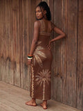 Back view of brown palm print one-shoulder maxi dress with open back