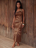Front view of brown fitted palm print one-shoulder maxi dress