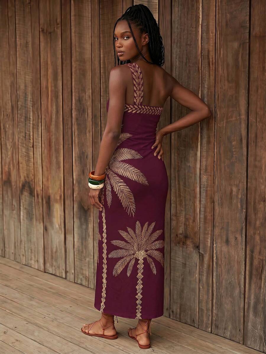 Back view of burgundy palm print one-shoulder maxi dress with open back