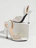 White peep-toe pearl and rhinestone mesh slingback with high flared heel