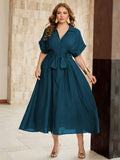 Shop a plus size bamboo linen V-neck dress with a front tie. Perfect for summer parties, brunch, garden events, vacations, and elegant warm-weather occasions.
