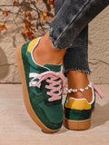 Rear-side view of green and yellow stripe sneakers with layered panels and gum soles