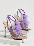 Studio display view of lavender snakeskin 3D floral cross-strap square-toe stiletto sandals with metallic heel