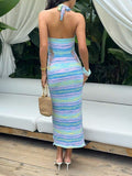 Back view of pastel striped halter knit midi dress with bare back, straight band and neck tie