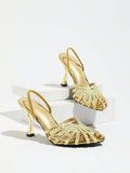 Gold open-toe flared-heel sandal with rhinestone straps