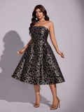 Side view of black floral jacquard strapless midi dress with cinched waist