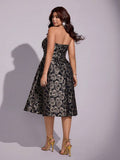 Back view of black and gold floral brocade strapless party dress