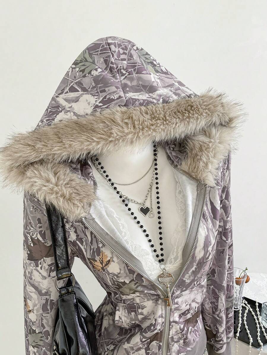 Front detail of taupe camo zip-up hoodie with ribbed hem and faux-fur hood