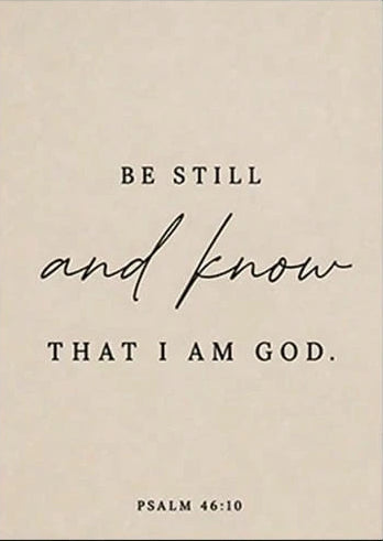 A beige rectangular wall art print with black text reading 'BE STILL and know THAT I AM GOD.' and 'PSALM 46:10,' shown with dimension arrows indicating 19.