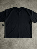 Plain back view of black oversized Christian T-shirt