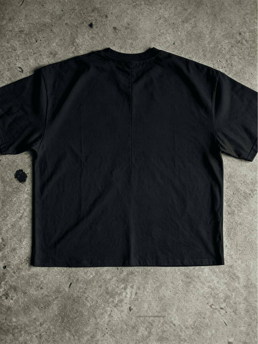 Plain back view of black oversized Christian T-shirt