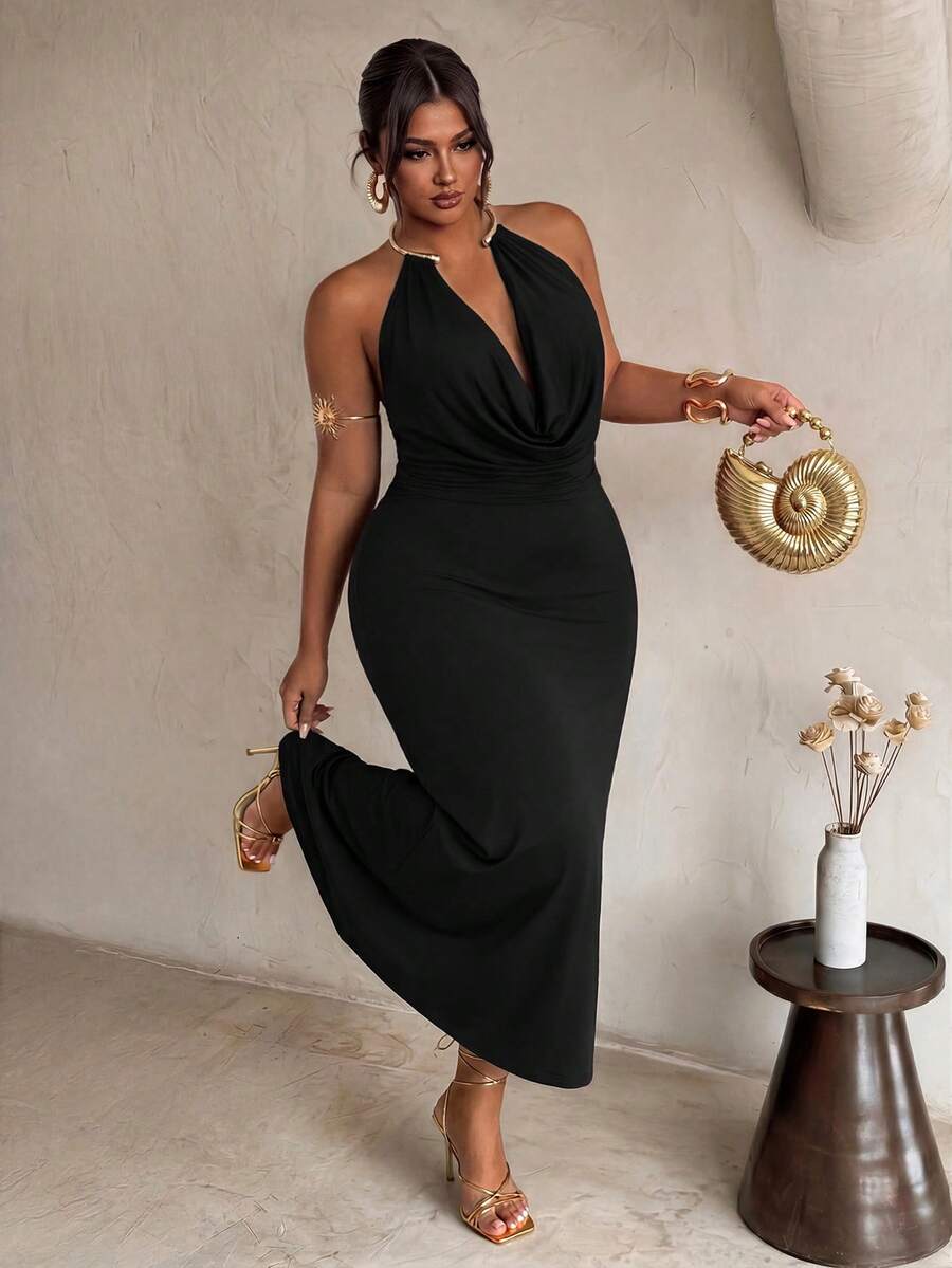 Front view of black plus size halter maxi dress with gold collar and draped neckline